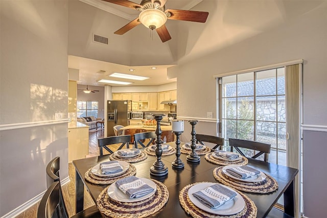 609 E Briarway Dr, Granite Shoals, TX 78654 - dining space featuring a towering ceiling, visible vents, a ceiling fan, and a skylight