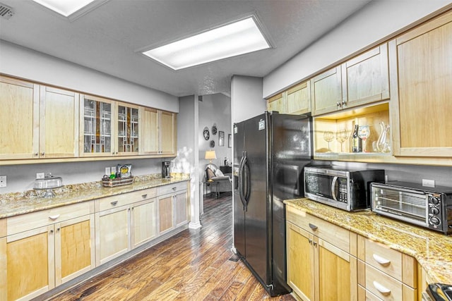 609 E Briarway Dr, Granite Shoals, TX 78654 - kitchen featuring light stone counters, light brown cabinetry, a toaster, stainless steel appliances, and dark wood-type flooring
