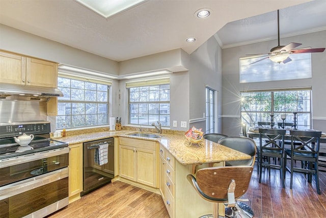 609 E Briarway Dr, Granite Shoals, TX 78654 - kitchen with range with two ovens, light brown cabinetry, dishwasher, and a sink