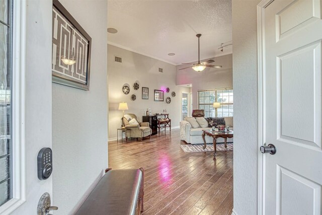 609 E Briarway Dr, Granite Shoals, TX 78654 - living room featuring hardwood / wood-style floors, a ceiling fan, ornamental molding, and baseboards