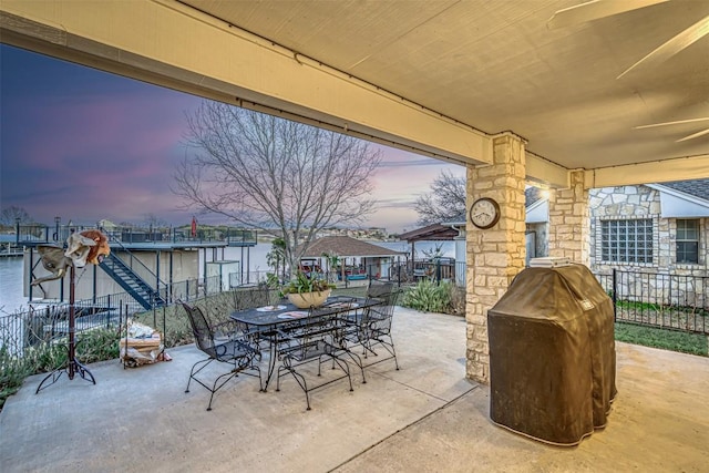 609 E Briarway Dr, Granite Shoals, TX 78654 - patio terrace at dusk featuring outdoor dining area and fence