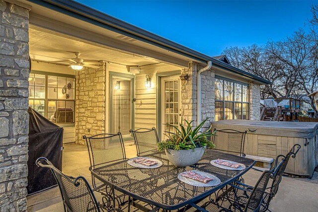 609 E Briarway Dr, Granite Shoals, TX 78654 - view of patio with a hot tub and outdoor dining area