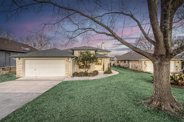 609 E Briarway Dr, Granite Shoals, TX 78654 - view of front of property with a yard, concrete driveway, a garage, a chimney, and stone siding