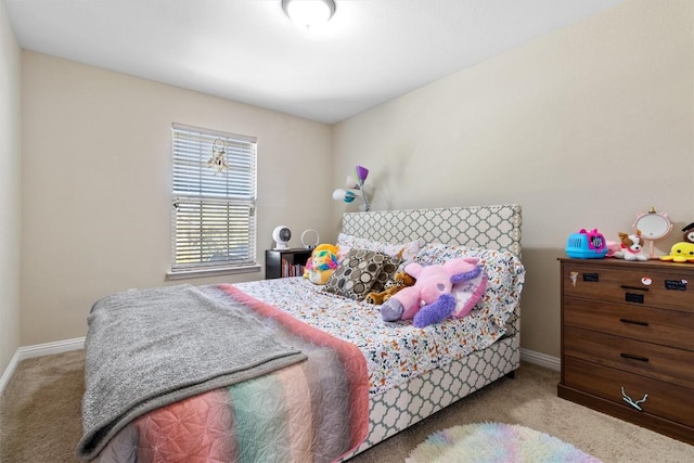 bedroom with baseboards and carpet flooring