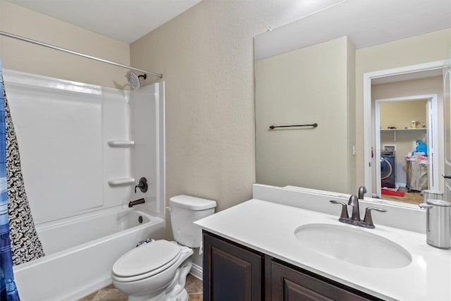 full bath featuring shower / bath combo with shower curtain, toilet, a textured wall, vanity, and washer / clothes dryer