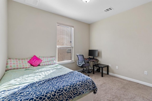 bedroom featuring visible vents, carpet flooring, and baseboards