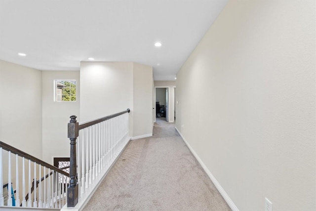 hall featuring baseboards, recessed lighting, an upstairs landing, and carpet flooring