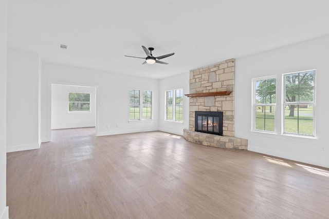 unfurnished living room featuring baseboards and wood finished floors