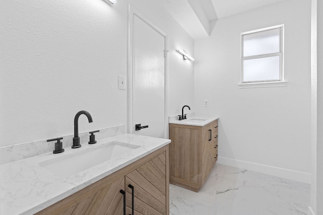 300 Fawn Ln, Georgetown, TX 78628 - bathroom featuring two vanities and marble look tile flooring