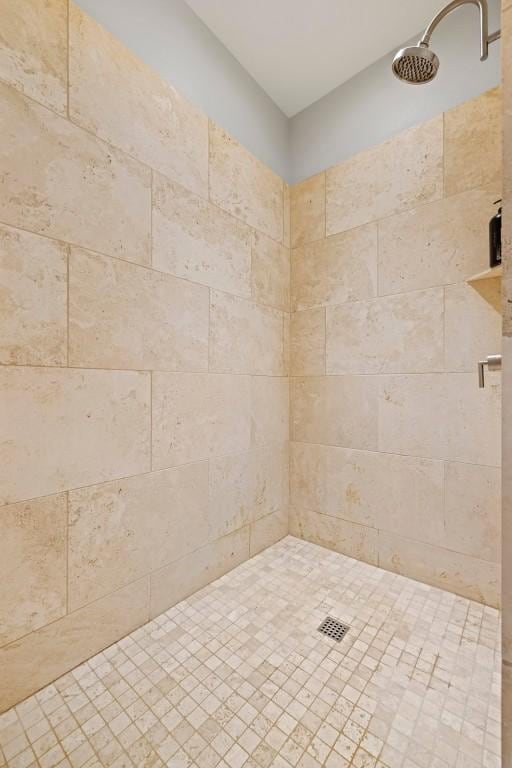 bathroom with a tile shower