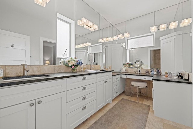 full bath featuring double vanity and a sink