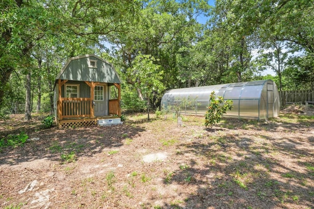 507 Arbors Cir, Elgin, TX 78621 - view of yard featuring a greenhouse and an outdoor structure