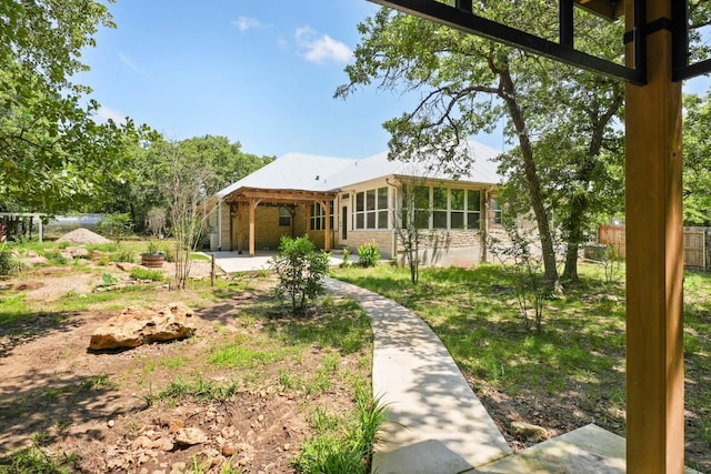 507 Arbors Cir, Elgin, TX 78621 - view of front facade featuring a patio and a sunroom