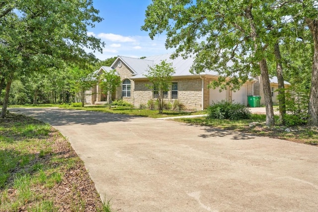 507 Arbors Cir, Elgin, TX 78621 - view of front of house featuring stone siding and driveway
