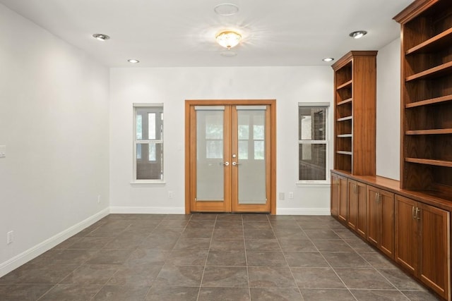 507 Arbors Cir, Elgin, TX 78621 - entryway featuring french doors, dark tile patterned flooring, and recessed lighting