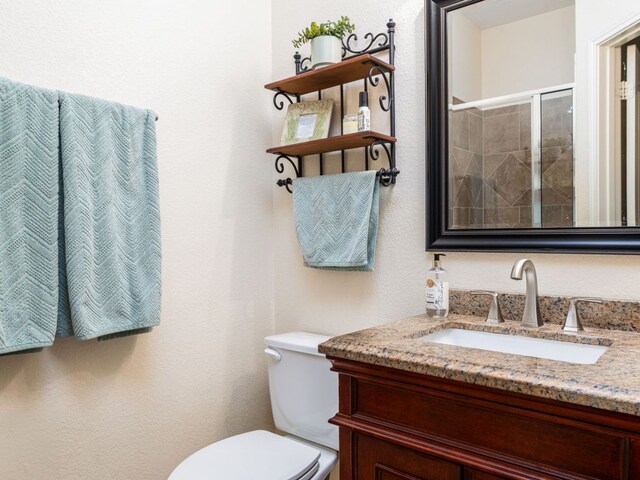 4525 Three Arrows Ct, Cedar Park, TX 78613 - bathroom featuring vanity, toilet, and tiled shower