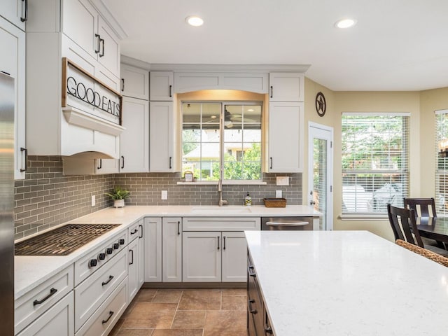 4525 Three Arrows Ct, Cedar Park, TX 78613 - kitchen with a sink, stainless steel appliances, recessed lighting, decorative backsplash, and light stone counters