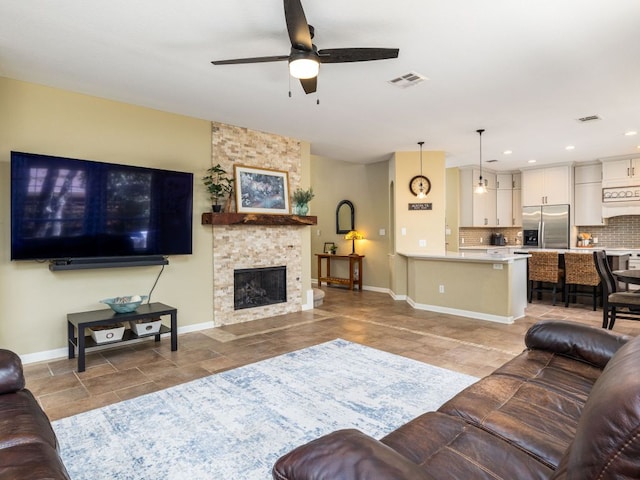 4525 Three Arrows Ct, Cedar Park, TX 78613 - living room with a ceiling fan, baseboards, a fireplace, and recessed lighting