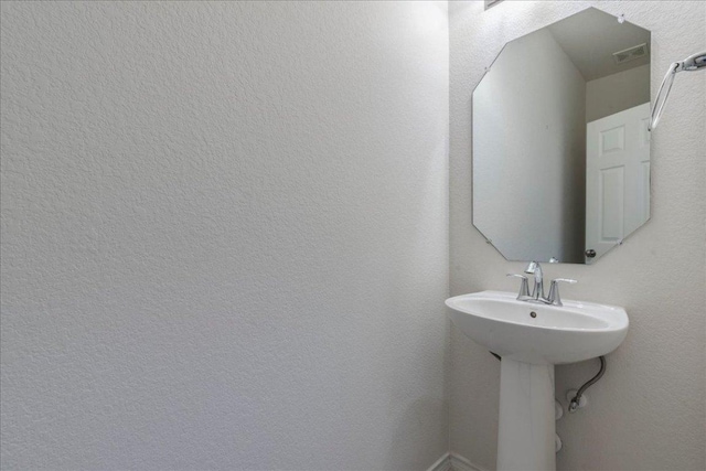 13305 Henneman Dr, Pflugerville, TX 78660 - bathroom with visible vents and a sink