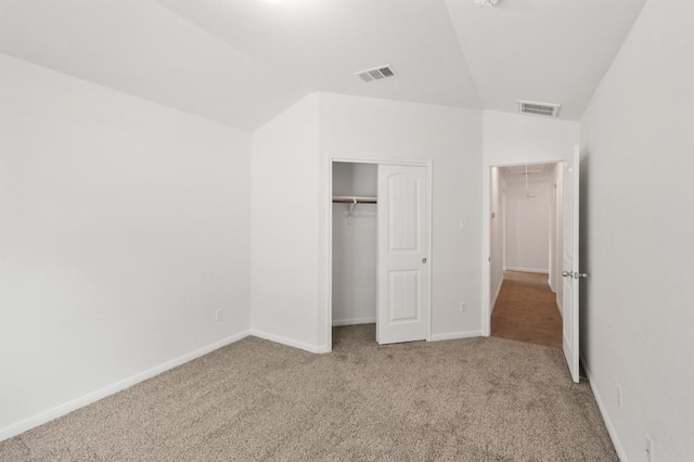 155 San Miniato St, Georgetown, TX 78628 - unfurnished bedroom with attic access, carpet flooring, vaulted ceiling, a closet, and baseboards