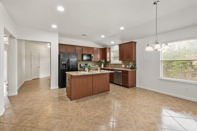 155 San Miniato St, Georgetown, TX 78628 - kitchen featuring black appliances, lofted ceiling, a chandelier, decorative backsplash, and light tile patterned floors