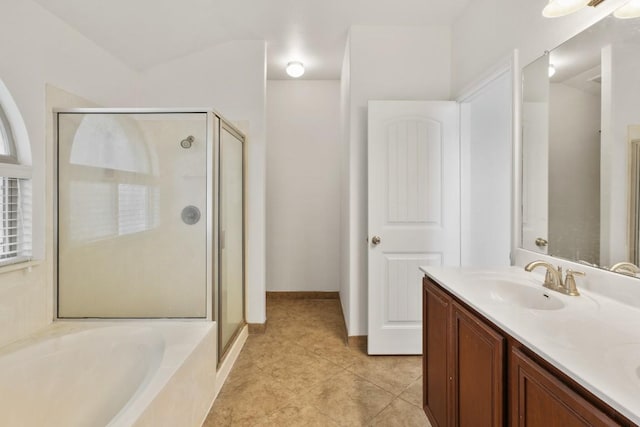155 San Miniato St, Georgetown, TX 78628 - bathroom featuring a stall shower, double vanity, a garden tub, and tile patterned floors