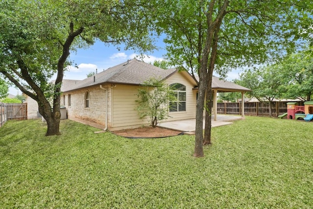 155 San Miniato St, Georgetown, TX 78628 - rear view of house featuring a patio area, a shingled roof, and stone siding
