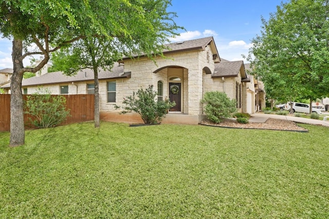 155 San Miniato St, Georgetown, TX 78628 - view of front of property with stone siding, a garage, and a shingled roof