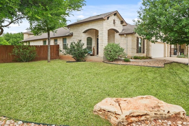155 San Miniato St, Georgetown, TX 78628 - view of front of property featuring stone siding, concrete driveway, a garage, and a shingled roof
