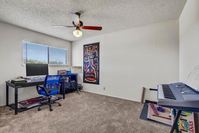 office with baseboards, a ceiling fan, a textured ceiling, and carpet flooring