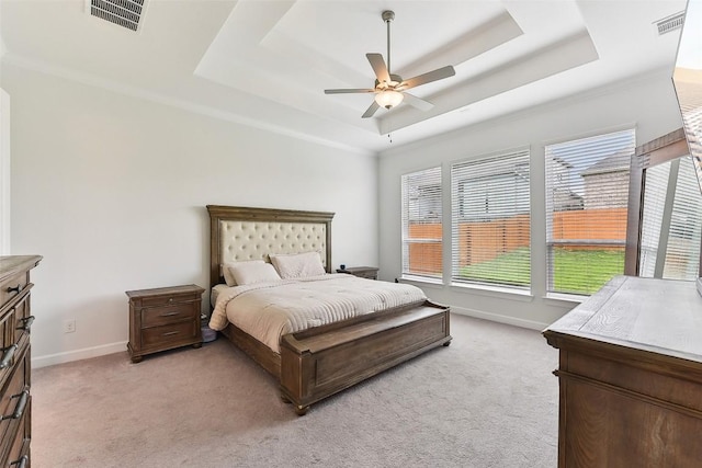 361 Wild Pecan Loop, Buda, TX 78610 - bedroom featuring a tray ceiling, light carpet, and a ceiling fan