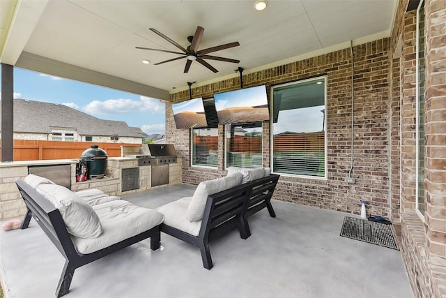 361 Wild Pecan Loop, Buda, TX 78610 - view of patio featuring an outdoor kitchen, ceiling fan, and an outdoor hangout area