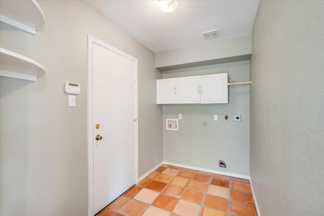 laundry area featuring cabinet space, hookup for a gas dryer, electric dryer hookup, hookup for a washing machine, and baseboards
