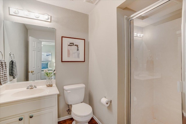 full bath featuring a shower stall, toilet, and vanity