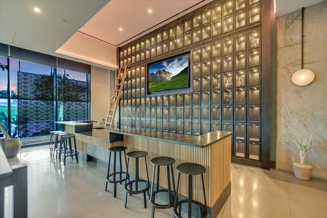 84 E Ave Unit 3909, Austin, TX 78701 - bar featuring expansive windows and a community bar