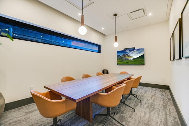84 E Ave Unit 3909, Austin, TX 78701 - dining room with a drop ceiling, carpet floors, and baseboards