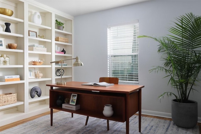 5707 Ave G, Austin, TX 78752 - office with wood finished floors and baseboards