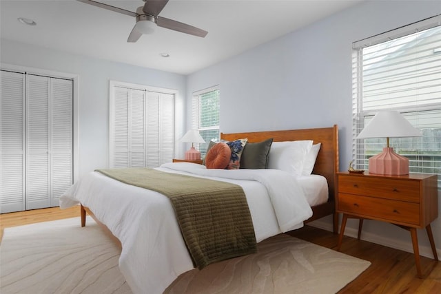 5707 Ave G, Austin, TX 78752 - bedroom featuring multiple closets, wood finished floors, recessed lighting, and ceiling fan