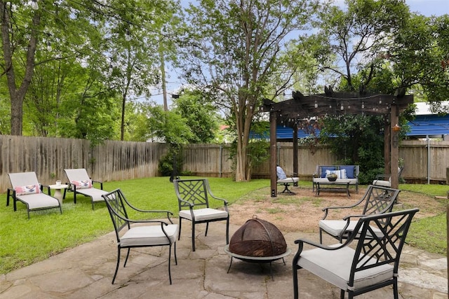 view of patio / terrace with a pergola, a fire pit, and a fenced backyard