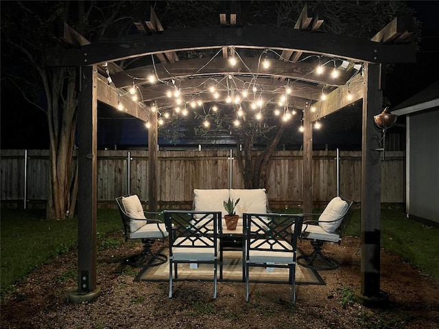 view of patio / terrace with a pergola, outdoor dining area, and a fenced backyard