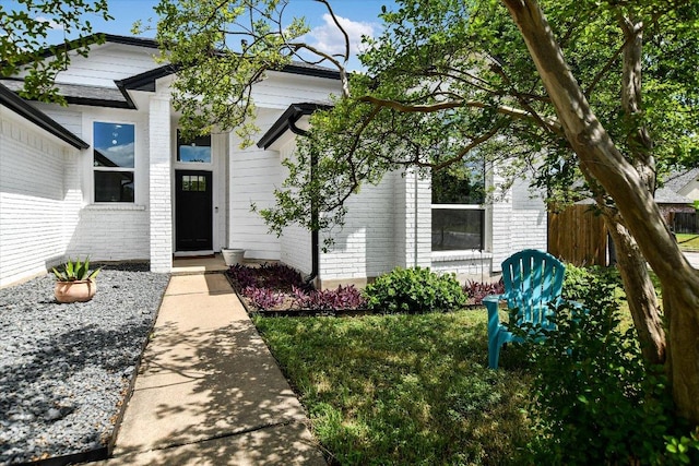 2208 Mimosa Trl, Round Rock, TX 78664 - property entrance featuring brick siding and fence