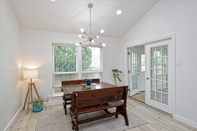 2208 Mimosa Trl, Round Rock, TX 78664 - dining space featuring baseboards, a notable chandelier, lofted ceiling, and light wood finished floors