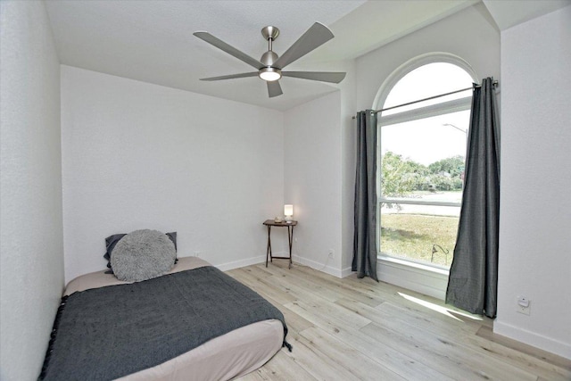 2208 Mimosa Trl, Round Rock, TX 78664 - bedroom featuring baseboards, light wood-type flooring, and a ceiling fan