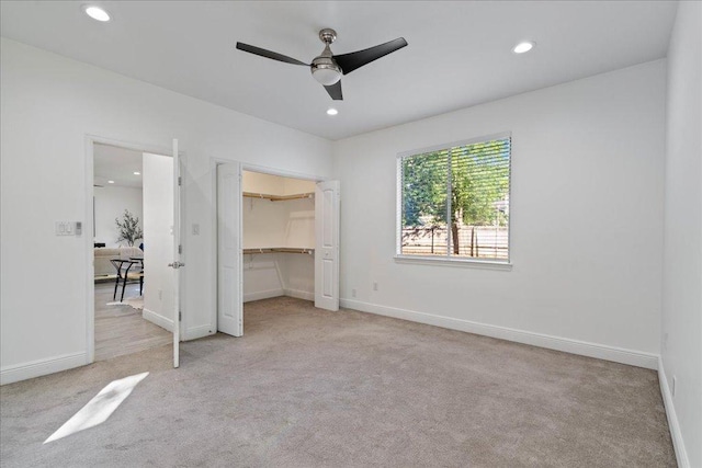 unfurnished bedroom featuring recessed lighting and carpet floors