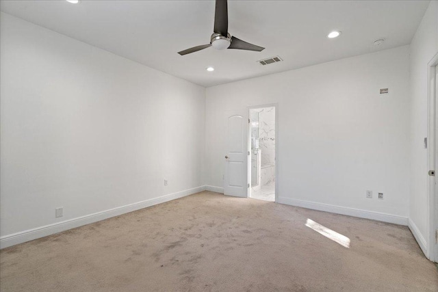 carpeted spare room featuring baseboards, visible vents, ceiling fan, and recessed lighting