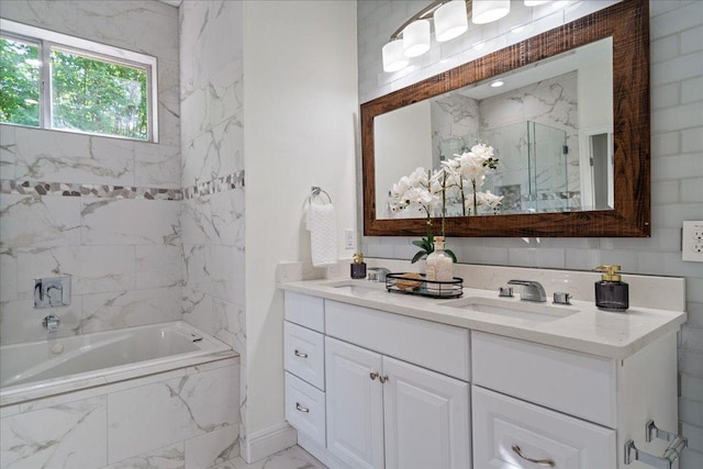 bathroom featuring marble finish floor, a sink, bath / shower combo with glass door, and double vanity