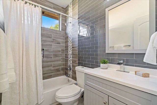 full bath featuring tile walls, backsplash, toilet, vanity, and shower / tub combo with curtain