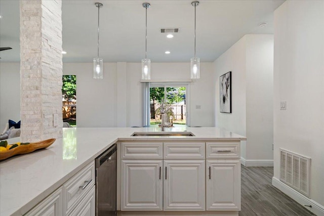 kitchen featuring a sink, decorative columns, a wealth of natural light, visible vents, and dishwasher