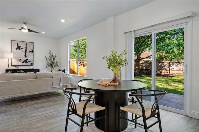 dining area with recessed lighting, a ceiling fan, light wood-style flooring, and baseboards