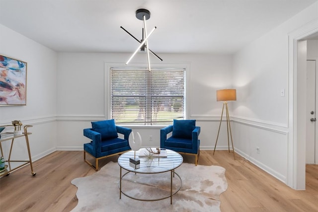living area with wood finished floors and baseboards